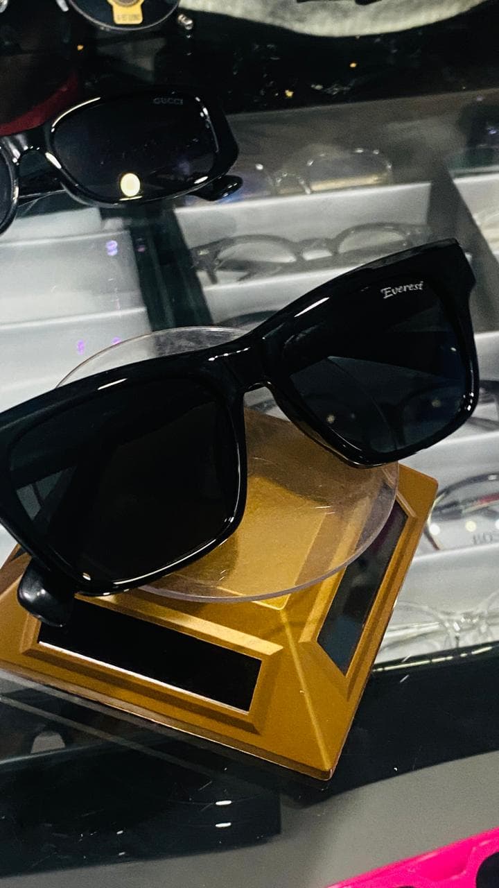 Black sunglasses photographed on a display stand