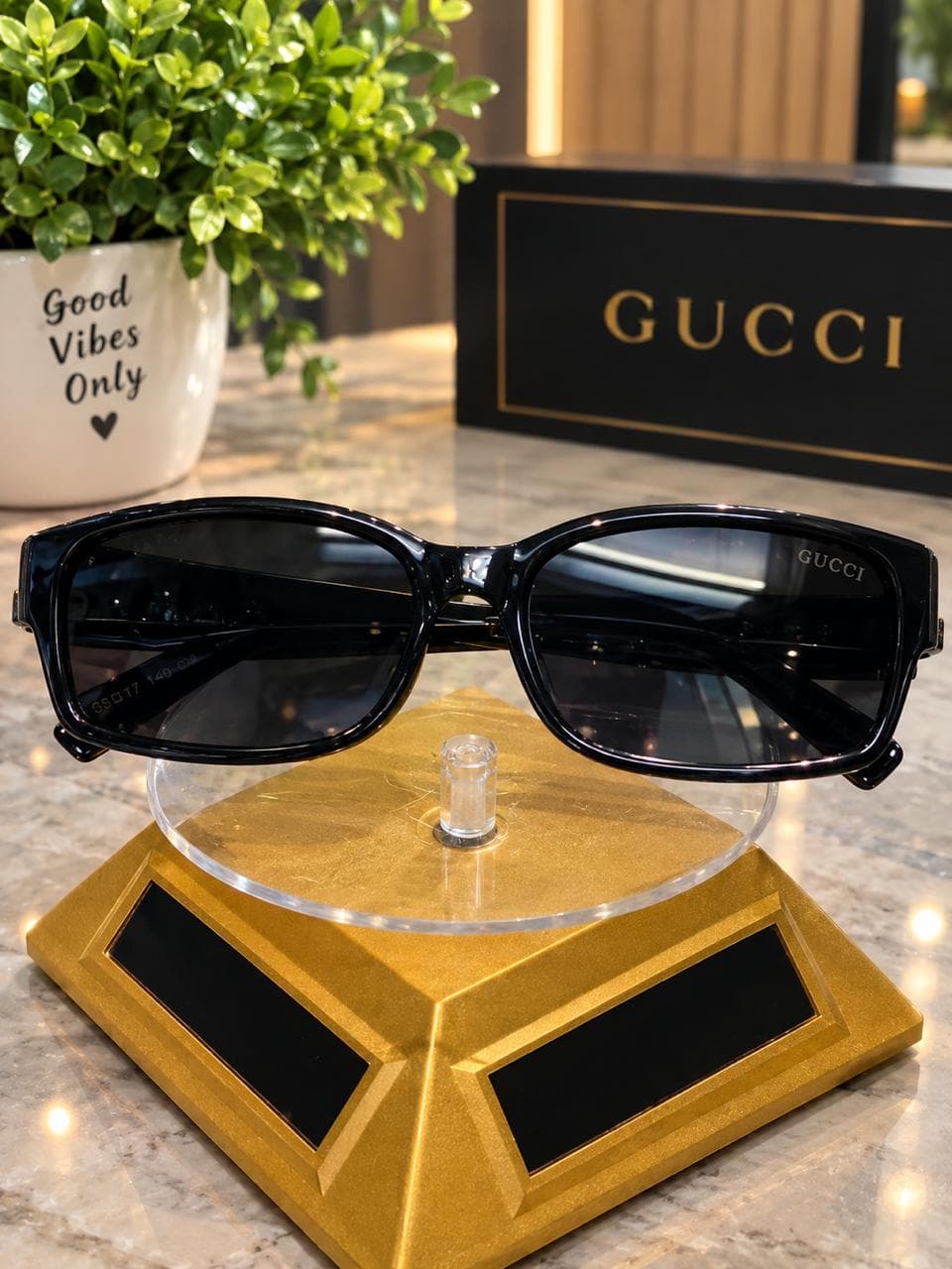 Black sunglasses displayed with a premium case